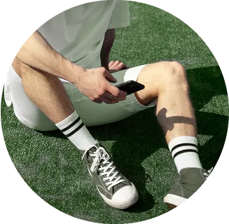 padel player siting mobile